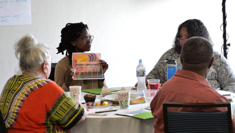 People in a meeting about Energy Democracy