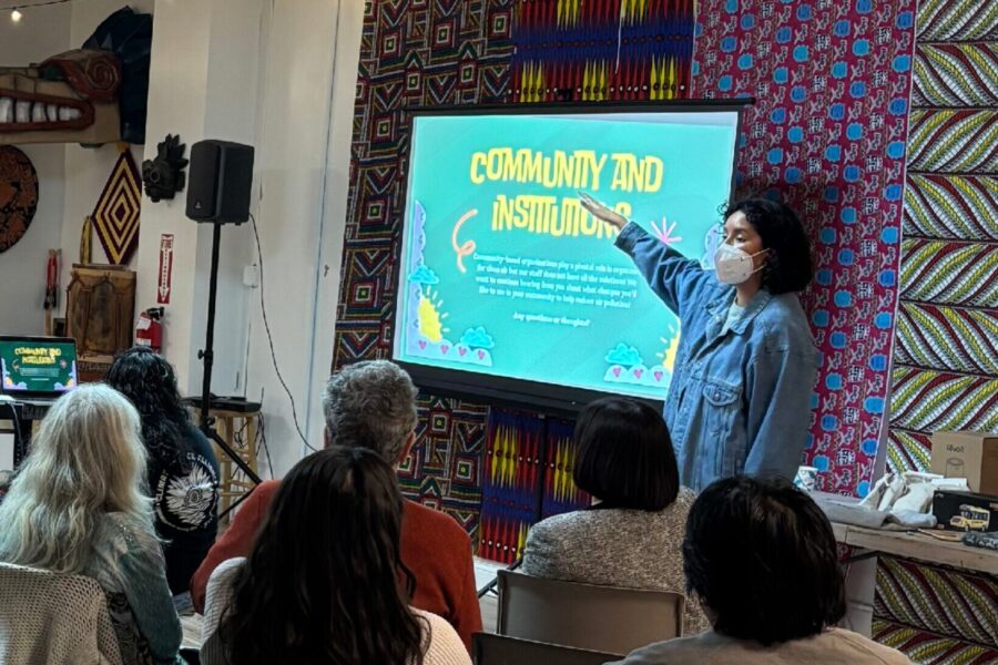 Community expert witness Melanie Minuche presents at a community meeting.