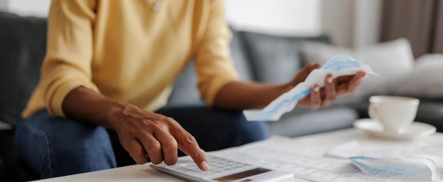 Close Up Of A Mid Adult Woman Checking Her Energy Bills At Home