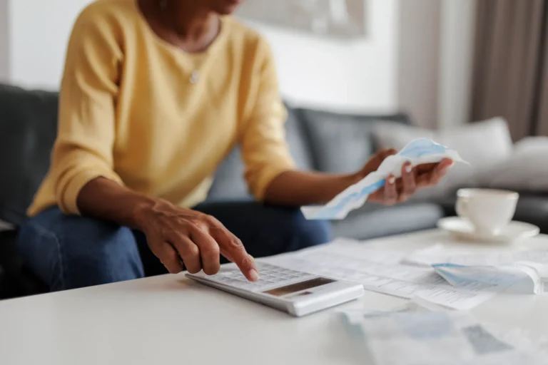 Close Up Of A Mid Adult Woman Checking Her Energy Bills At Home
